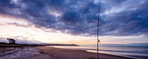 Preview wallpaper beach, sea, fishing rod, fishing, twilight