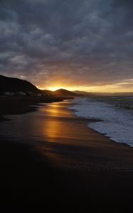 Preview wallpaper beach, sea, foam, hills, sunset