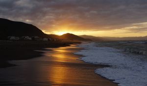 Preview wallpaper beach, sea, foam, hills, sunset