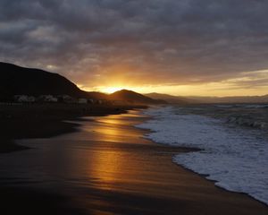 Preview wallpaper beach, sea, foam, hills, sunset