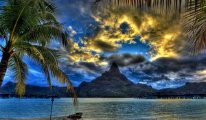 Preview wallpaper beach, sea, mountain, top, clouds, palm trees, sand, branches