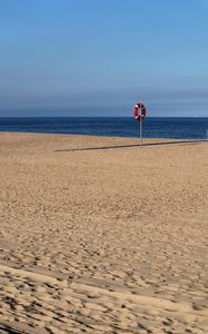 Preview wallpaper beach, sea, sand, lifebuoy, sky