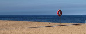 Preview wallpaper beach, sea, sand, lifebuoy, sky