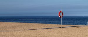 Preview wallpaper beach, sea, sand, lifebuoy, sky