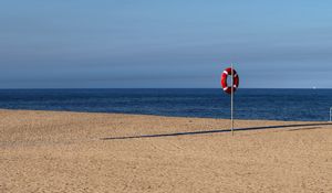 Preview wallpaper beach, sea, sand, lifebuoy, sky