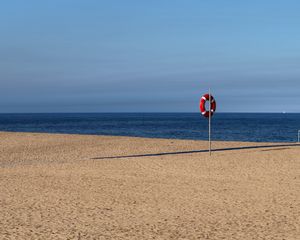 Preview wallpaper beach, sea, sand, lifebuoy, sky