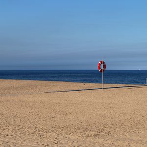 Preview wallpaper beach, sea, sand, lifebuoy, sky