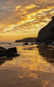 Preview wallpaper beach, sea, sunset, rocks, landscape, nature, summer