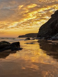 Preview wallpaper beach, sea, sunset, rocks, landscape, nature, summer