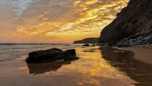 Preview wallpaper beach, sea, sunset, rocks, landscape, nature, summer