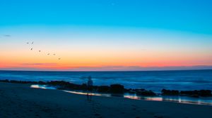 Preview wallpaper beach, silhouette, dusk, coast, sunset