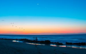 Preview wallpaper beach, silhouette, dusk, coast, sunset