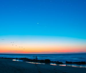 Preview wallpaper beach, silhouette, dusk, coast, sunset