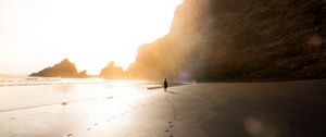 Preview wallpaper beach, silhouette, rocks, coast, sunlight