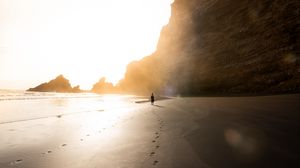 Preview wallpaper beach, silhouette, rocks, coast, sunlight