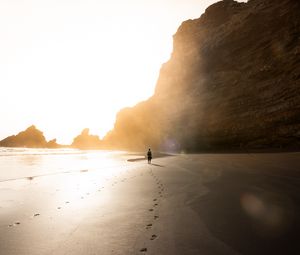 Preview wallpaper beach, silhouette, rocks, coast, sunlight