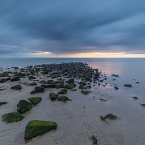 Preview wallpaper beach, stones, sand, water, sea, horizon