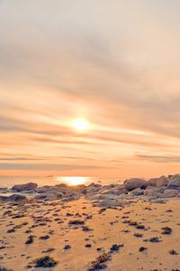 Preview wallpaper beach, stones, sea, sun, sunset