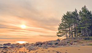 Preview wallpaper beach, stones, sea, sun, sunset
