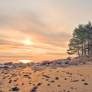 Preview wallpaper beach, stones, sea, sun, sunset