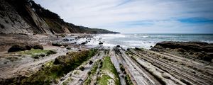 Preview wallpaper beach, stones, trees, mountains, sea, horizon, landscape