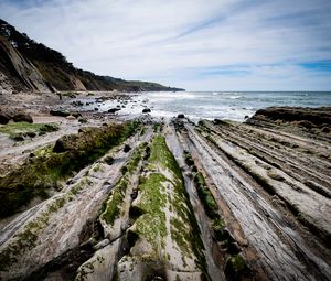 Preview wallpaper beach, stones, trees, mountains, sea, horizon, landscape