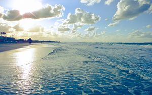 Preview wallpaper beach, sun, coast, sand, wet, foam, people, clouds, waves