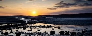 Preview wallpaper beach, sunset, water, stones, sand, sea, dusk