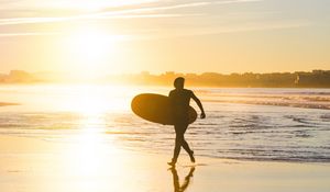 Preview wallpaper beach, surfing, board, sunset, sea, sun