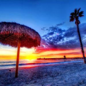 Preview wallpaper beach, tropics, sea, sand, palm trees, sunset, beautiful