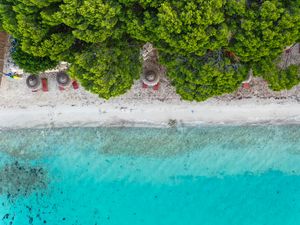 Preview wallpaper beach, umbrella, sea, aerial view, trees