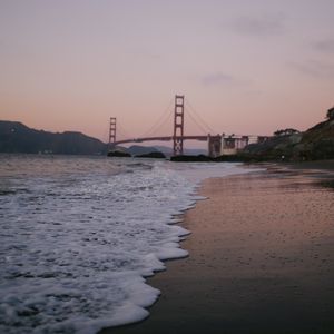 Preview wallpaper beach, waves, bridge, dusk