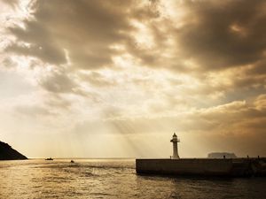 Preview wallpaper beacon, beams, sun, water, sea, sky