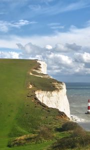 Preview wallpaper beacon, mountains, coast, breakage, sea