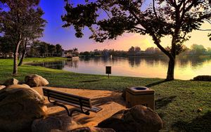 Preview wallpaper bench, park, lake, coast, stones, evening, lawn