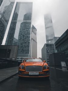 Preview wallpaper bentley continental gt, bentley, car, orange, front view, city, buildings