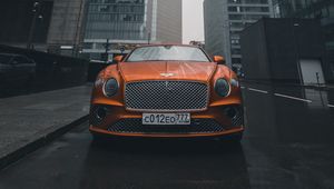 Preview wallpaper bentley continental gt, bentley, car, orange, front view, city, buildings