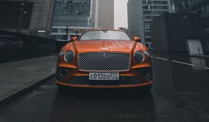 Preview wallpaper bentley continental gt, bentley, car, orange, front view, city, buildings