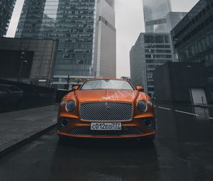 Preview wallpaper bentley continental gt, bentley, car, orange, front view, city, buildings