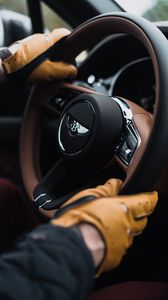 Preview wallpaper bentley, steering wheel, hands, gloves, car