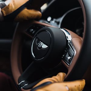 Preview wallpaper bentley, steering wheel, hands, gloves, car