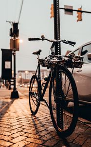 Preview wallpaper bicycle, black, sidewalk, street, city
