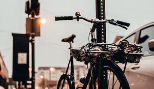 Preview wallpaper bicycle, black, sidewalk, street, city