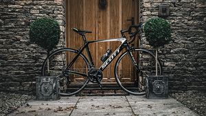 Preview wallpaper bicycle, door, plants, wall, stone