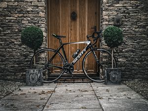 Preview wallpaper bicycle, door, plants, wall, stone