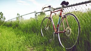 Preview wallpaper bicycle, fence, field, grass, summer