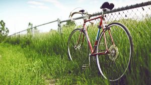 Preview wallpaper bicycle, fence, field, grass, summer