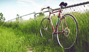 Preview wallpaper bicycle, fence, field, grass, summer