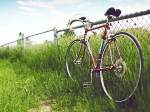 Preview wallpaper bicycle, fence, field, grass, summer