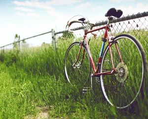 Preview wallpaper bicycle, fence, field, grass, summer